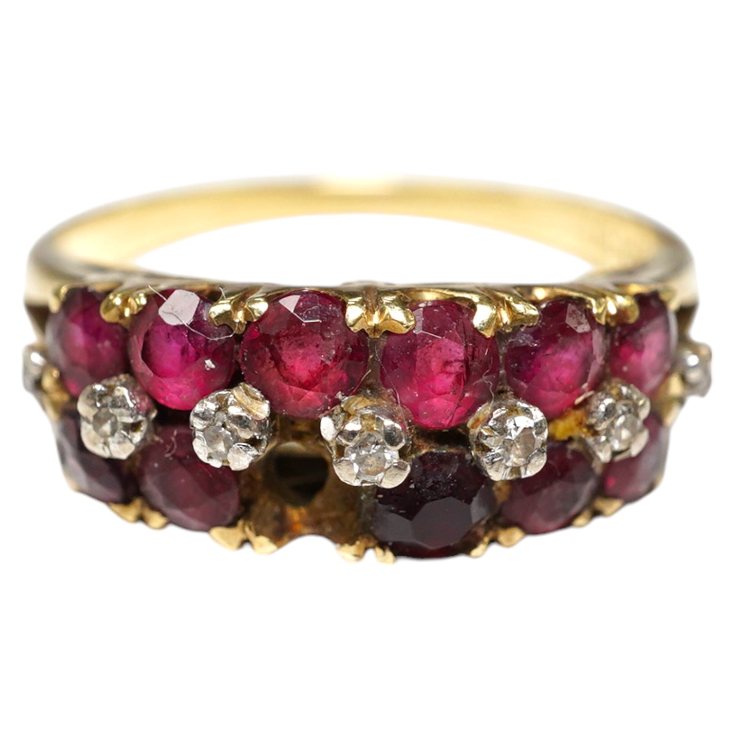 An 18k ruby and diamond set dress ring, one ruby missing, size M, gross 3.7 grams